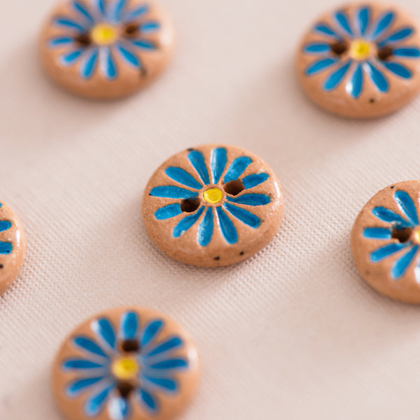 bright blue daisy buttons